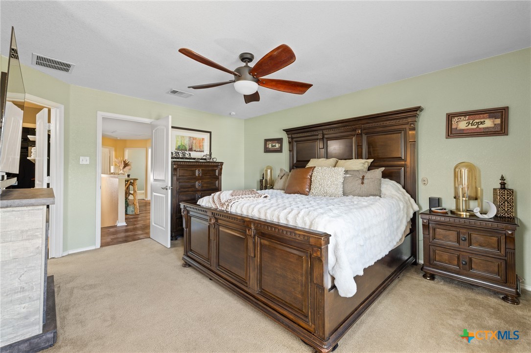 9142 Sage Loop Court Temple, TX 76502 - Photo 17 of 27 a bedroom with a bed and dresser