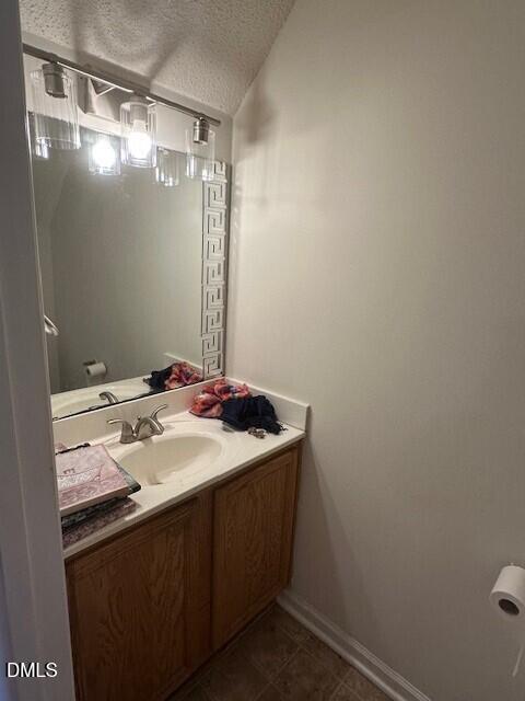 4801 Tanglewood Oaks Street Raleigh, NC 27610 - Photo 5 of 12 a bathroom with a sink and mirror