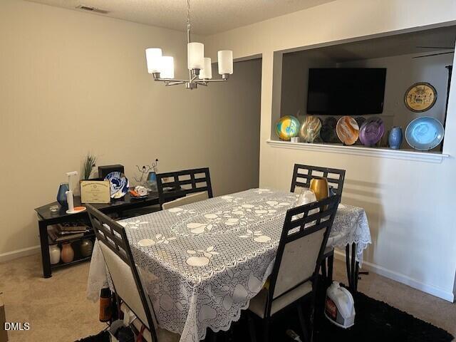 4801 Tanglewood Oaks Street Raleigh, NC 27610 - Photo 8 of 12 a view of a dining room with furniture and wooden floor