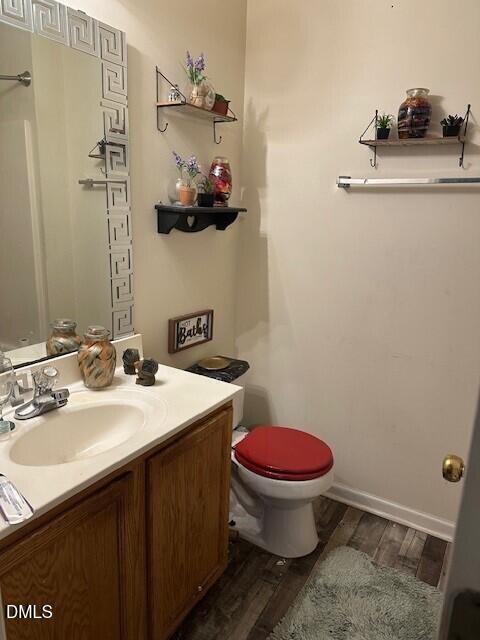 4801 Tanglewood Oaks Street Raleigh, NC 27610 - Photo 10 of 12 a bathroom with a sink toilet and a mirror