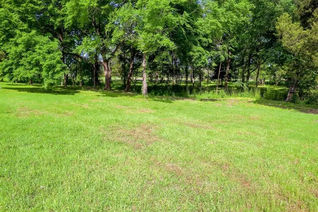 a view of outdoor space with deck and yard