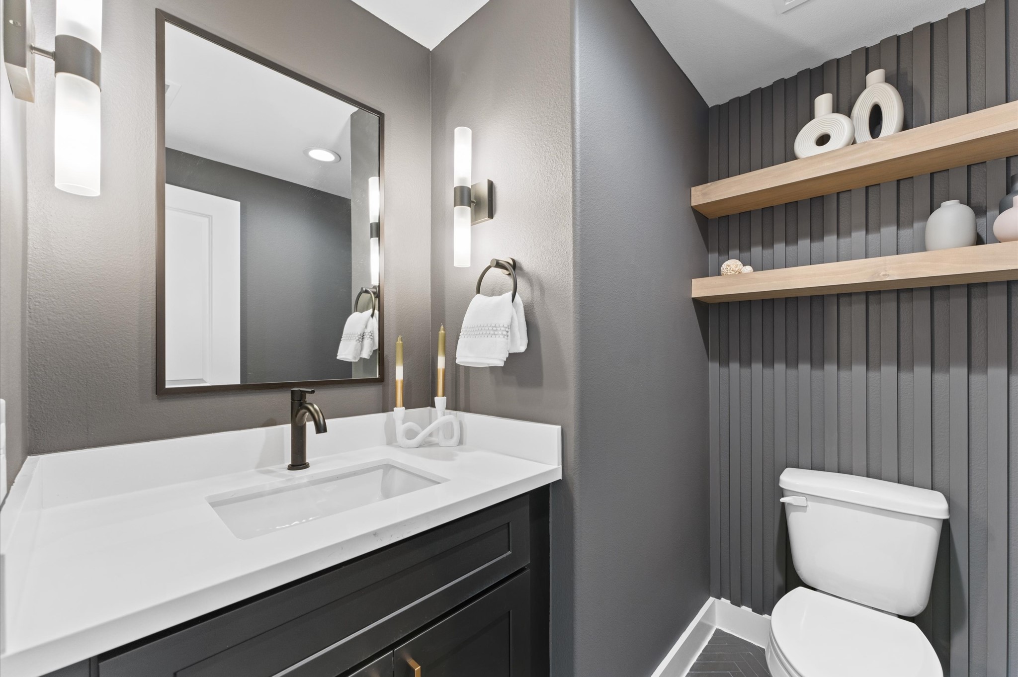 7805 Amelia Road, Unit B Houston, TX 77055 - Photo 27 of 35 Half bath on second floor. Photos are from a previous NJA Homes development. Floor plan, finishes & specifications may vary.