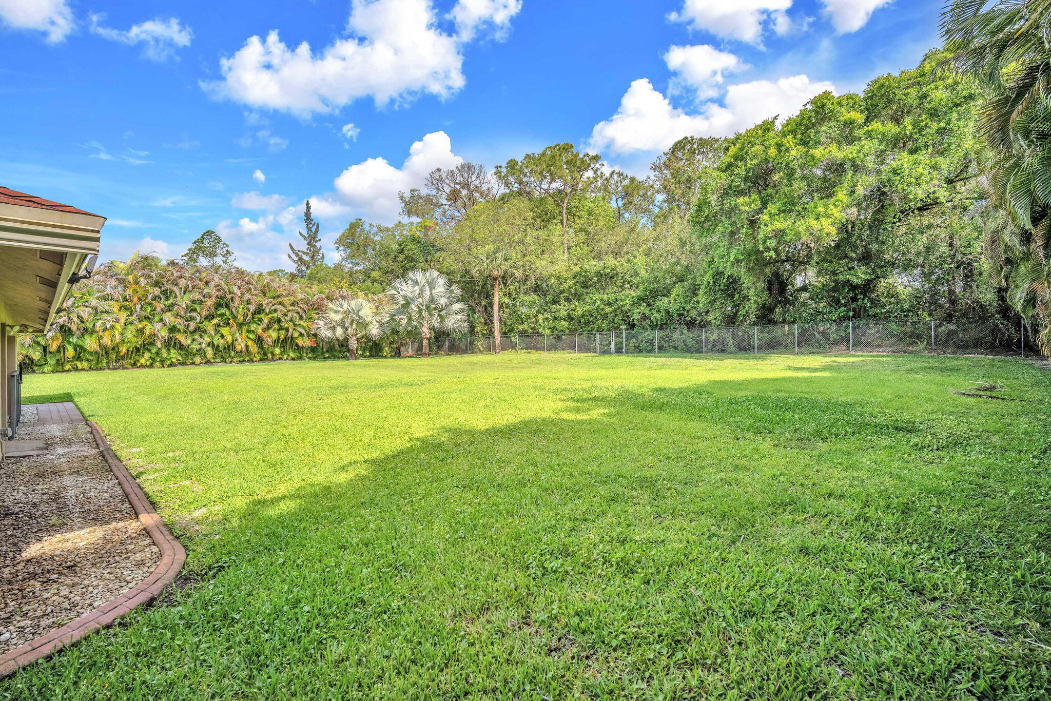 13759 Doubletree Trail Wellington, FL 33414 - Photo 11 of 76 a view of a building with a big yard