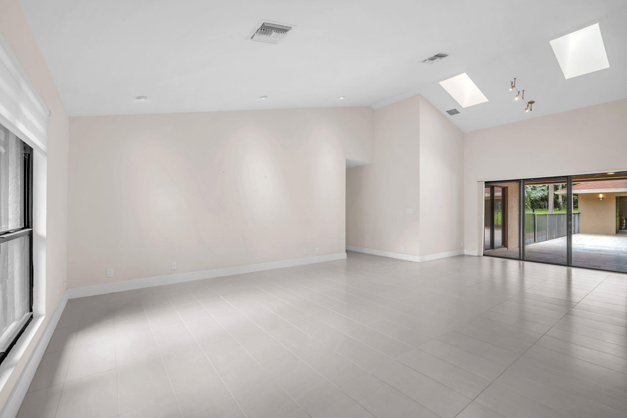 13759 Doubletree Trail Wellington, FL 33414 - Photo 23 of 76 a view of empty room with wooden floor and fan