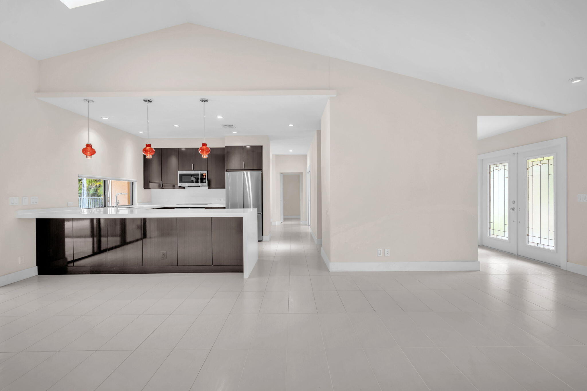 13759 Doubletree Trail Wellington, FL 33414 - Photo 26 of 76 a living room with kitchen island furniture and a kitchen view