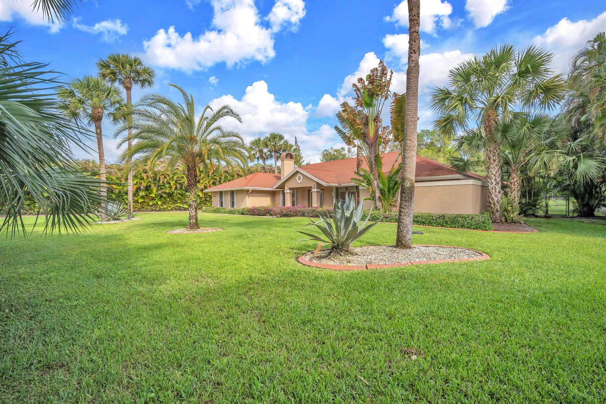 13759 Doubletree Trail Wellington, FL 33414 - Photo 3 of 76 a view of a house with a backyard