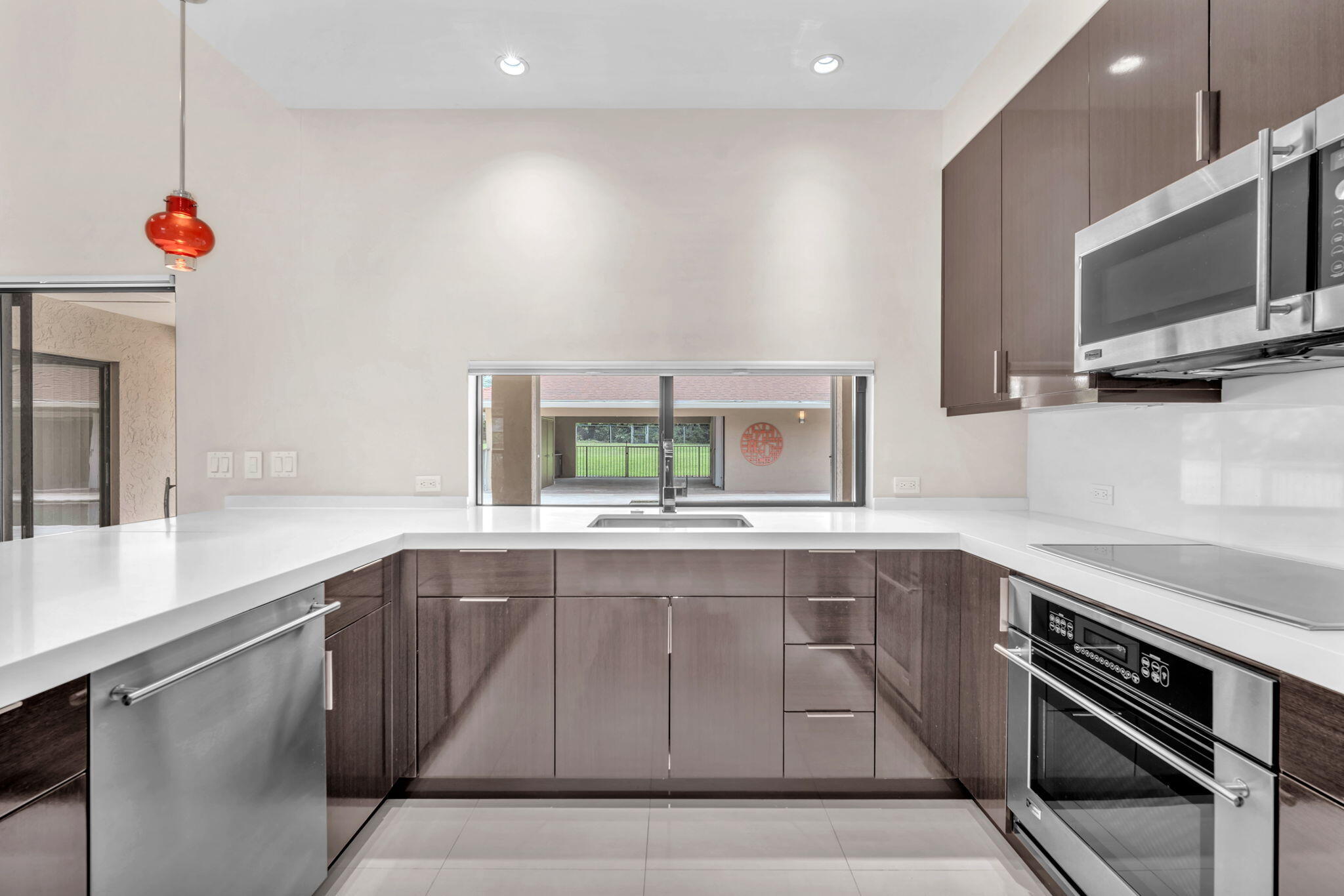 13759 Doubletree Trail Wellington, FL 33414 - Photo 33 of 76 a kitchen with a sink and a microwave