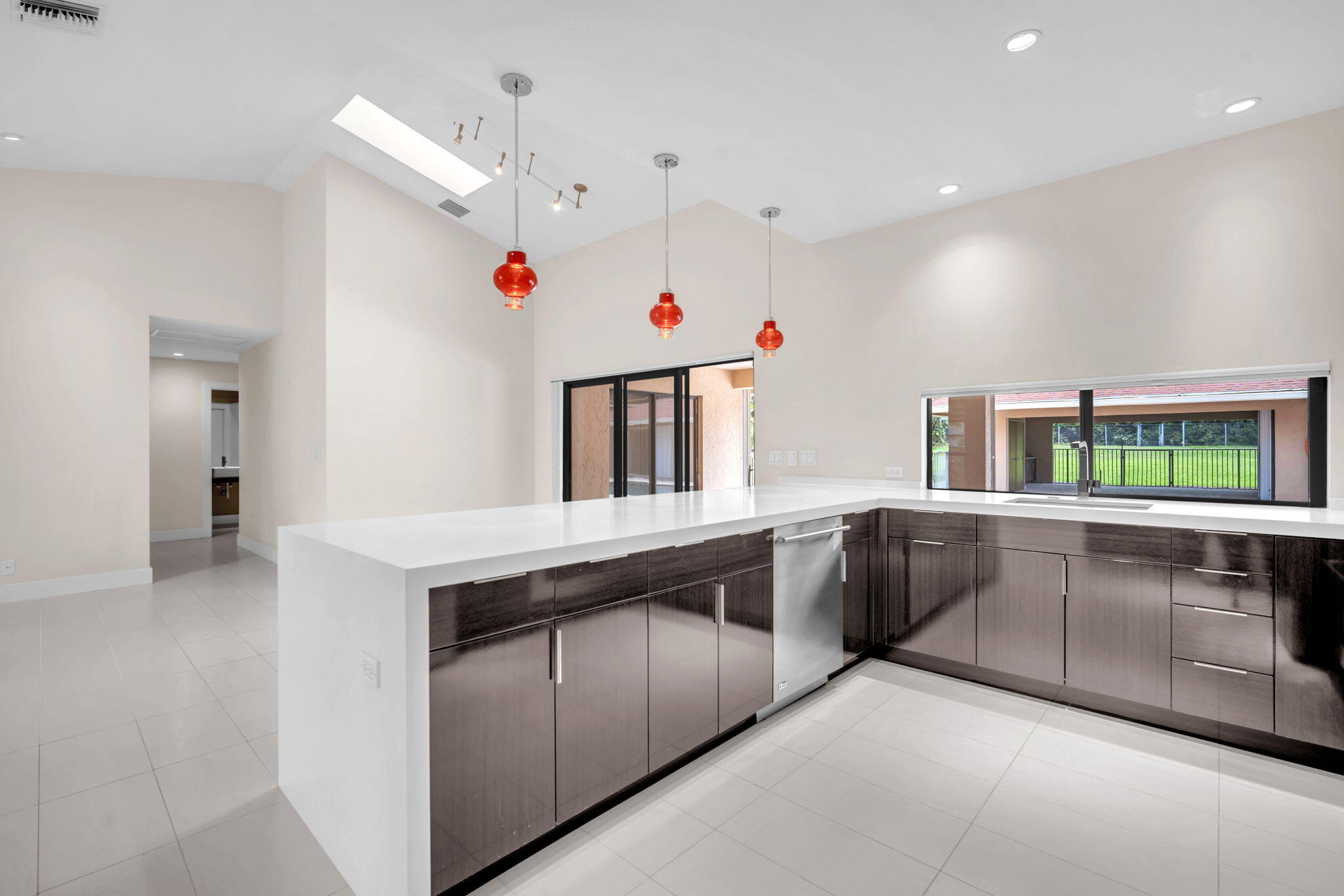 13759 Doubletree Trail Wellington, FL 33414 - Photo 35 of 76 a kitchen that has a stove and a sink