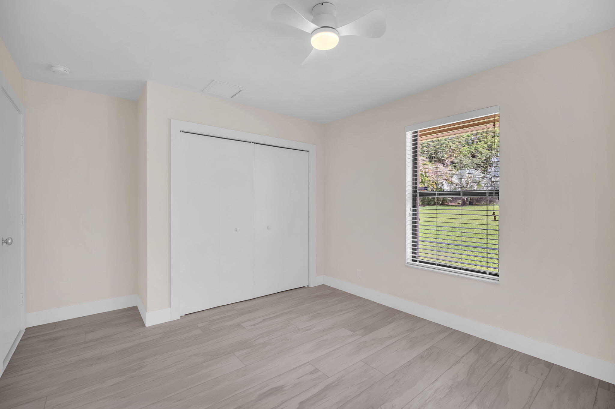 13759 Doubletree Trail Wellington, FL 33414 - Photo 50 of 76 an empty room with wooden floor and windows