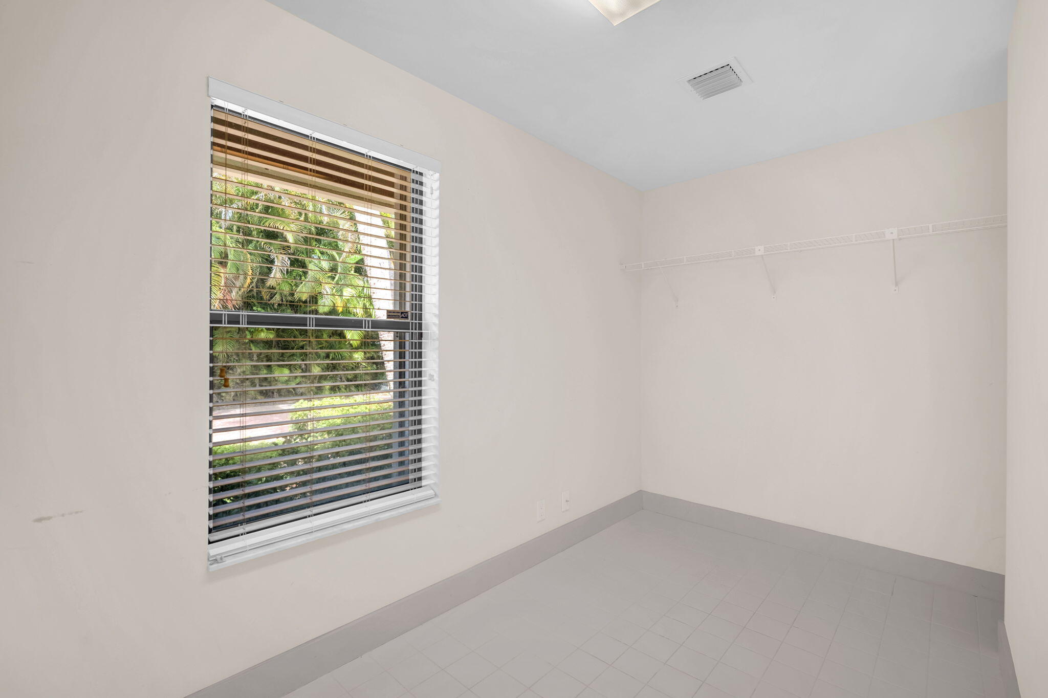 13759 Doubletree Trail Wellington, FL 33414 - Photo 51 of 76 a view of an empty room with a window