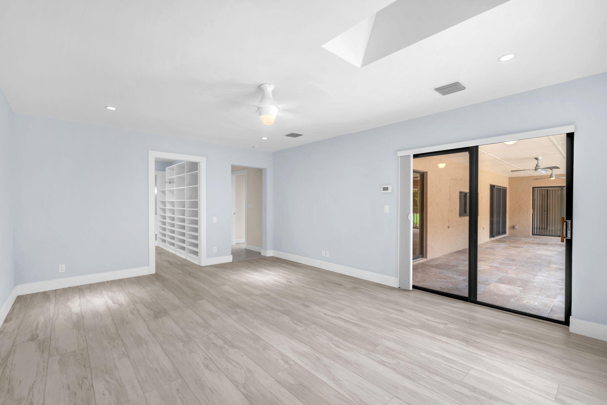 13759 Doubletree Trail Wellington, FL 33414 - Photo 54 of 76 a view of an empty room with wooden floor and windows