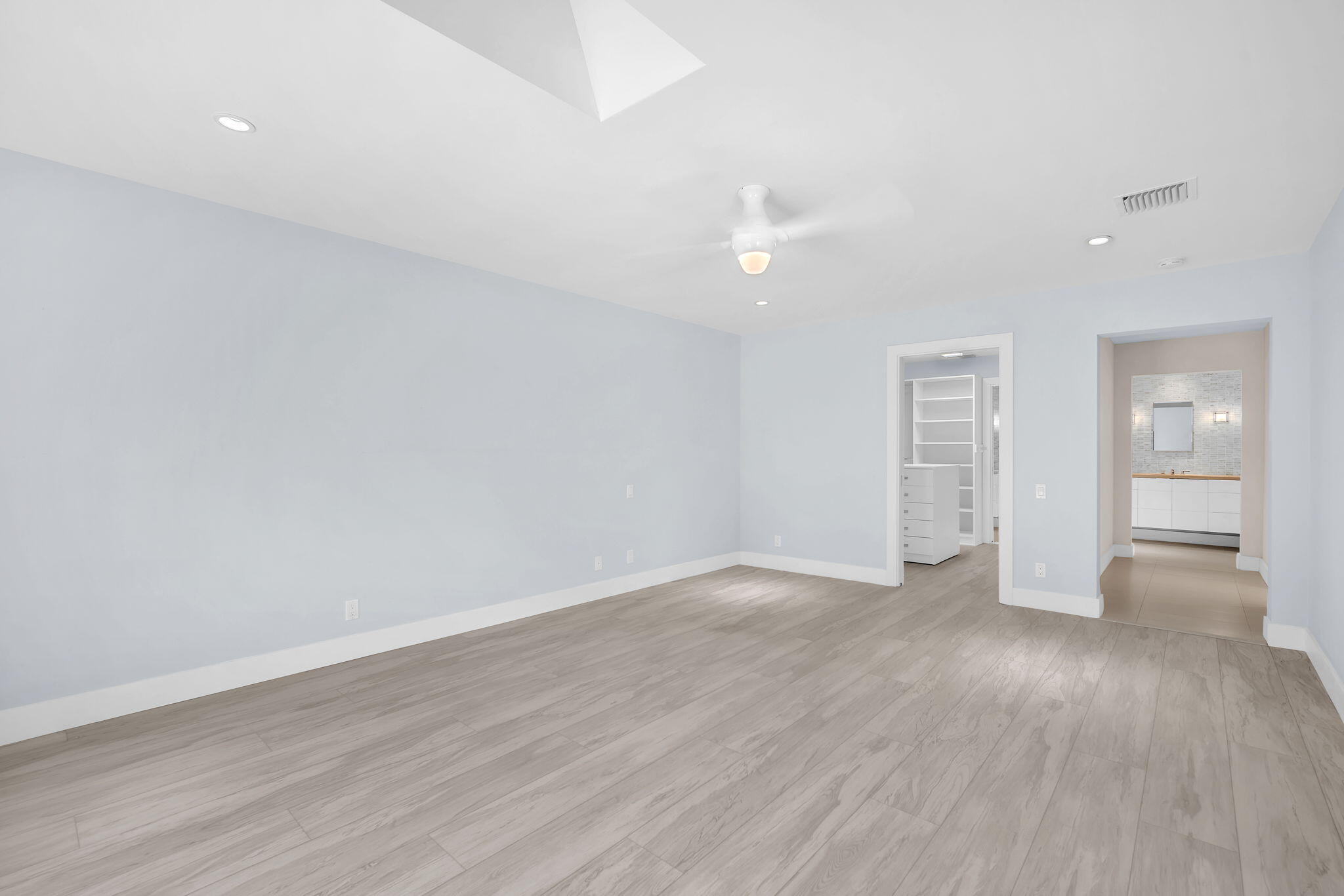 13759 Doubletree Trail Wellington, FL 33414 - Photo 55 of 76 a view of an empty room with wooden floor and a window