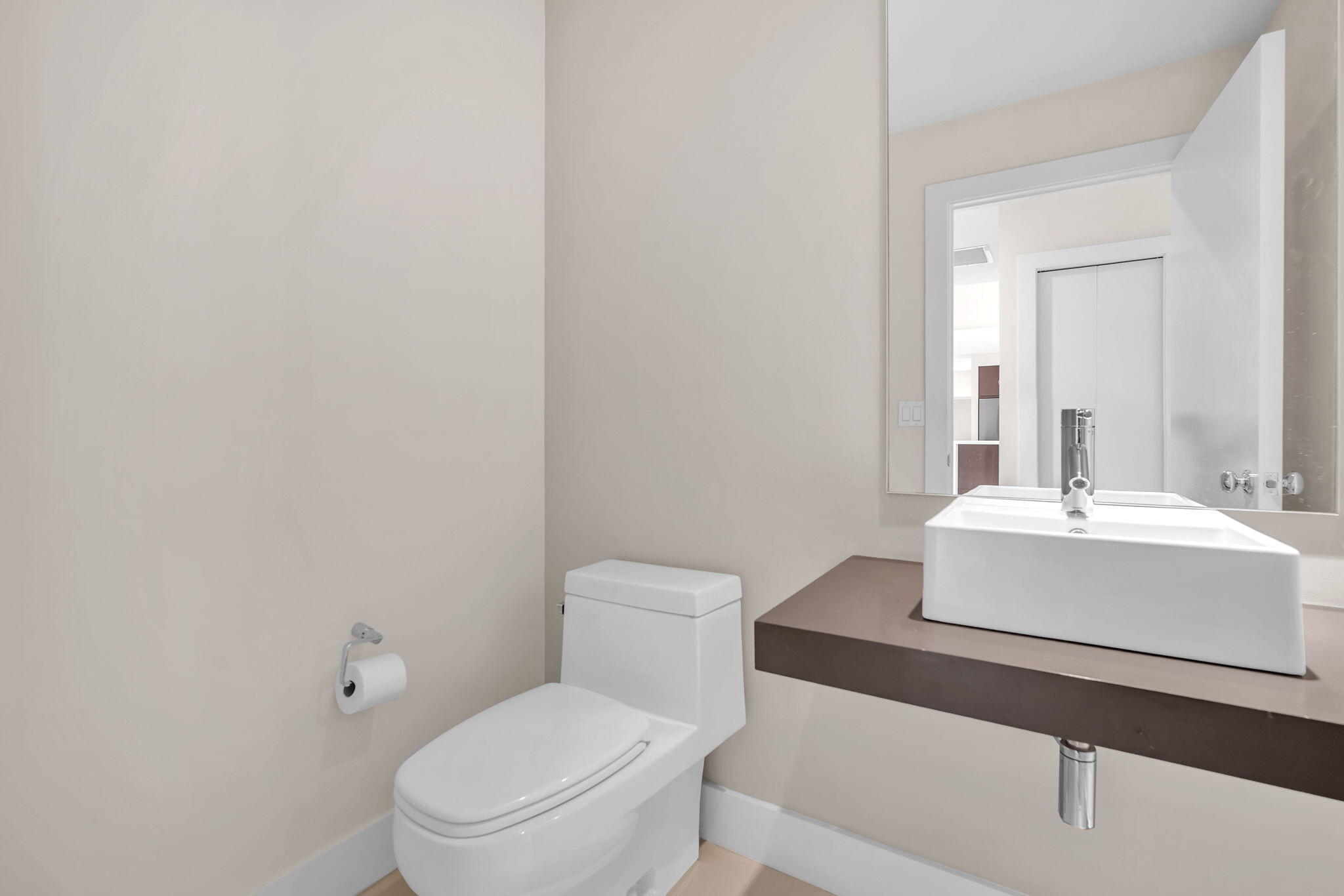 13759 Doubletree Trail Wellington, FL 33414 - Photo 60 of 76 a white toilet sitting next to a bathroom sink