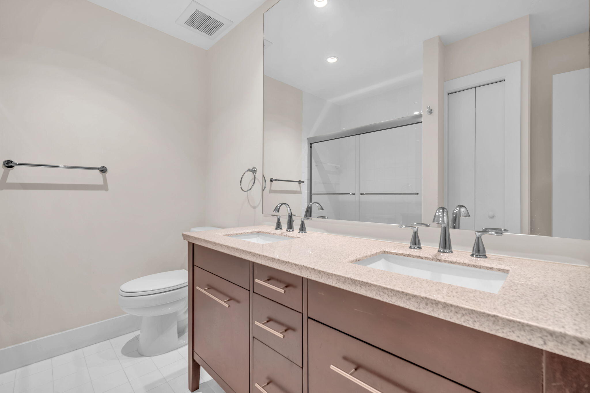 13759 Doubletree Trail Wellington, FL 33414 - Photo 61 of 76 a bathroom with a granite countertop sink a toilet and a mirror