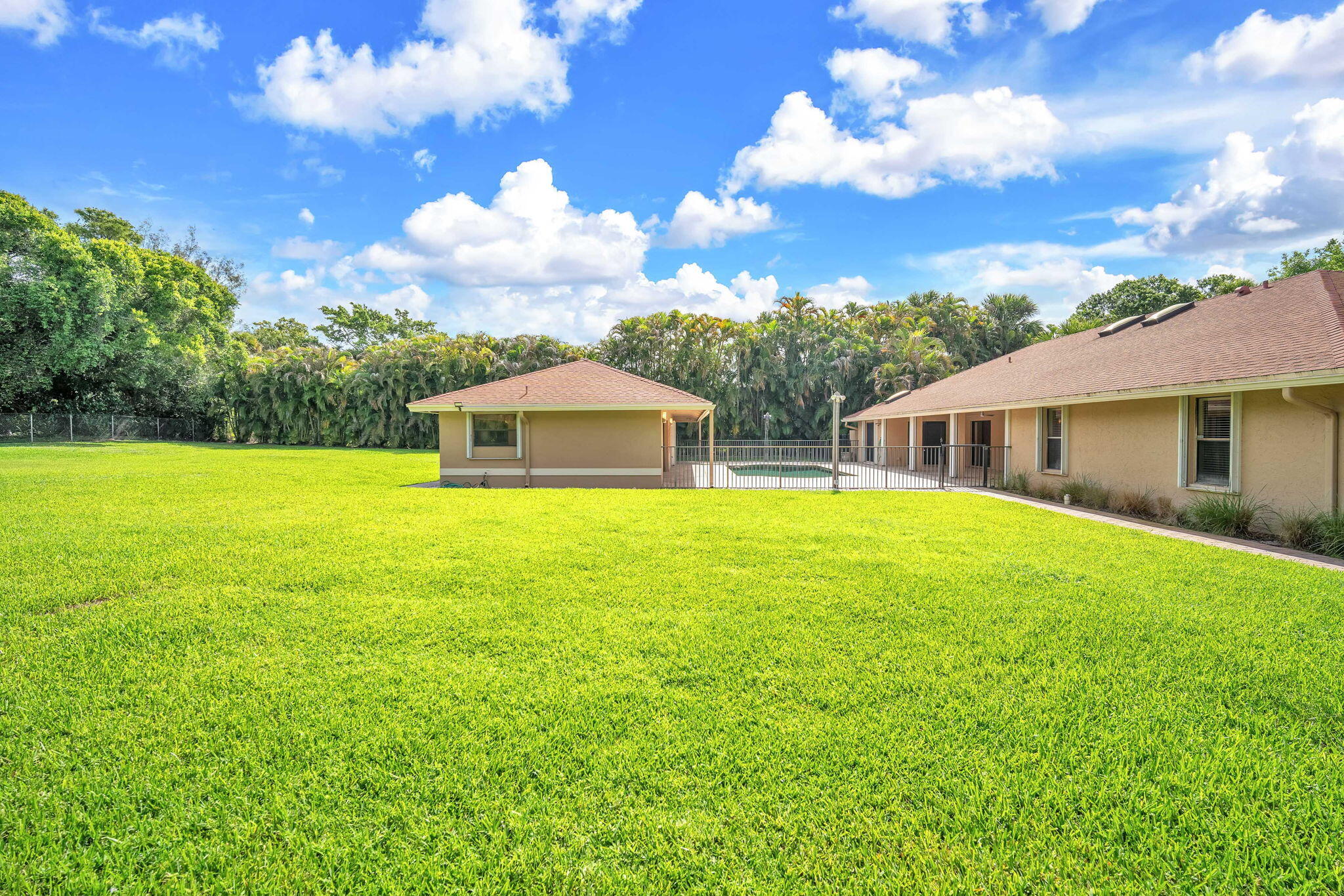 13759 Doubletree Trail Wellington, FL 33414 - Photo 7 of 76 a big house with swimming pool in front of it