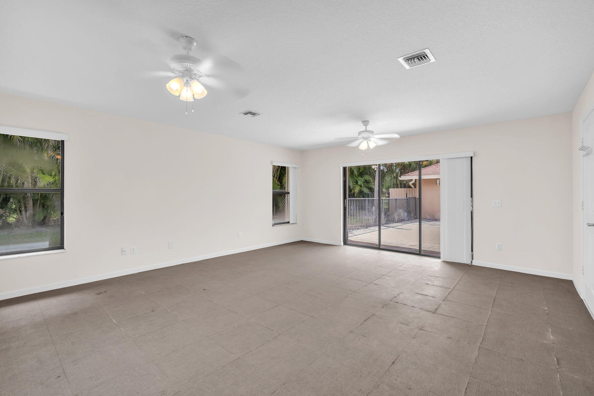 13759 Doubletree Trail Wellington, FL 33414 - Photo 75 of 76 an empty room with windows and entrance