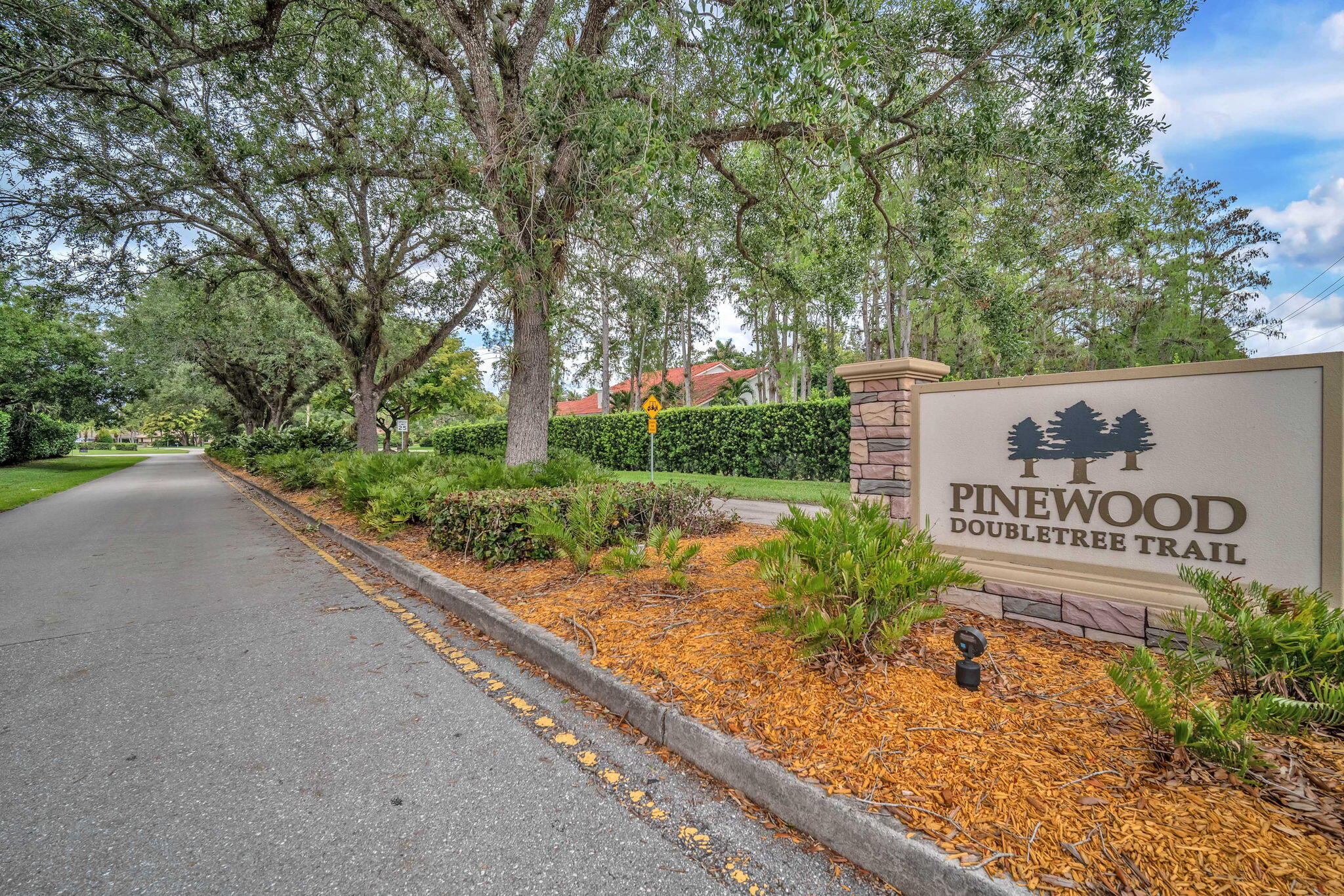 13759 Doubletree Trail Wellington, FL 33414 - Photo 76 of 76 a view of a street with benches in the background