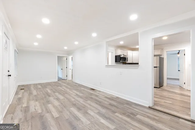 a view of a livingroom with wooden floor