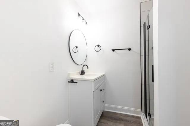 a bathroom with a sink and mirror