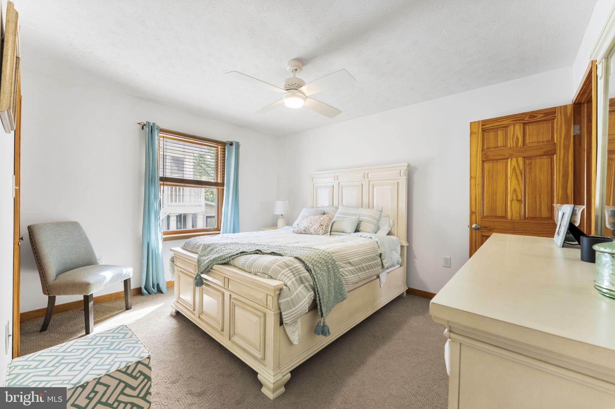 94 Crescent Lane Elkton, MD 21921 - Photo 22 of 59 a bed room with a bed and chair