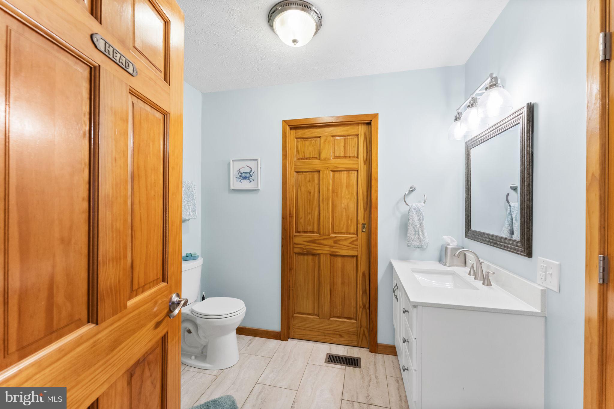 94 Crescent Lane Elkton, MD 21921 - Photo 24 of 59 a bathroom with a granite countertop sink toilet and shower