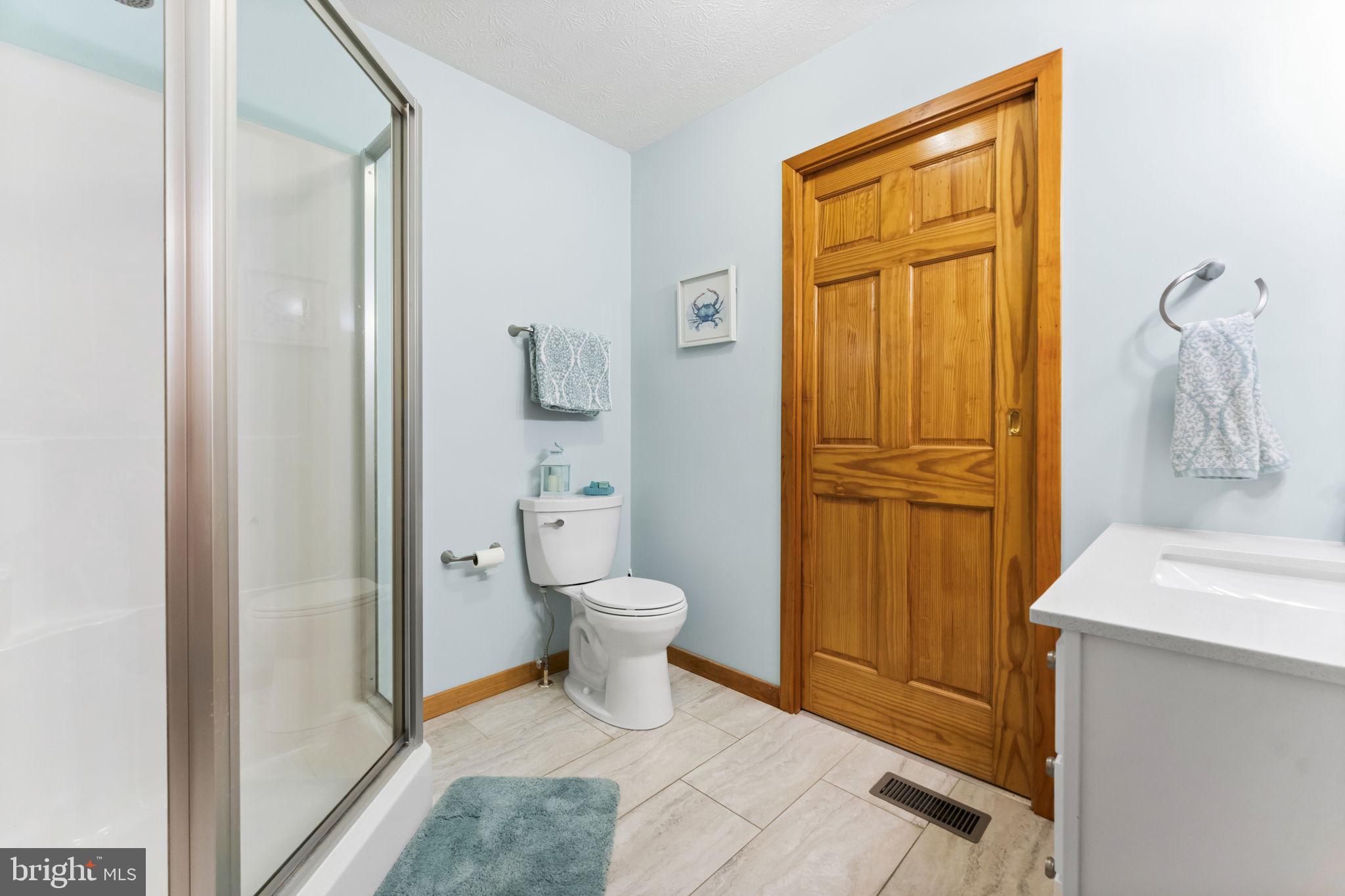 94 Crescent Lane Elkton, MD 21921 - Photo 25 of 59 a bathroom with a sink a toilet and shower