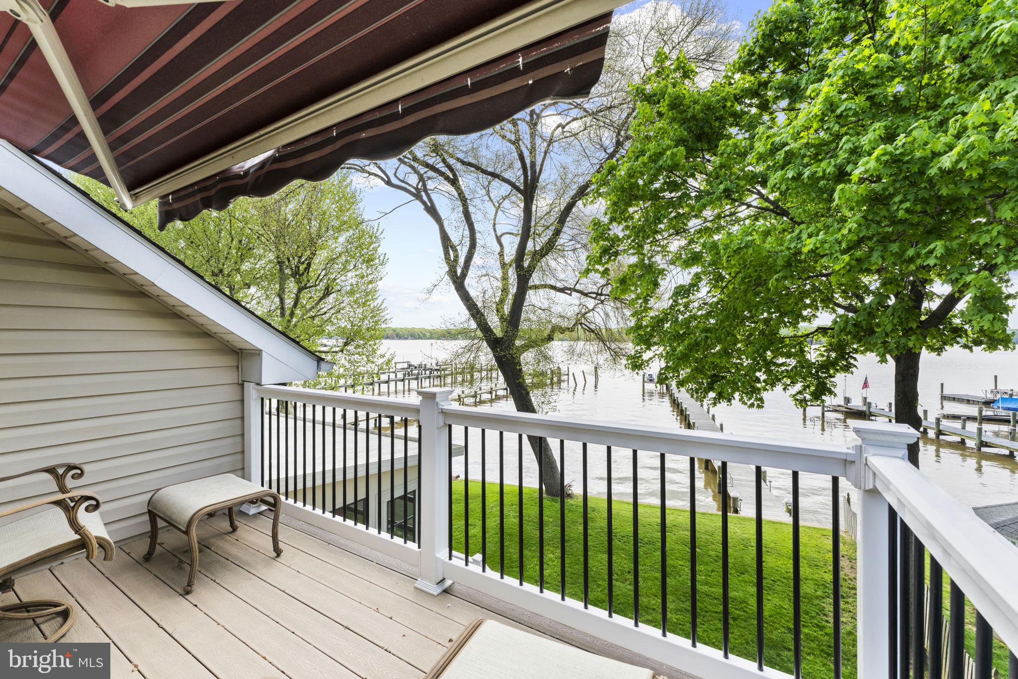 94 Crescent Lane Elkton, MD 21921 - Photo 32 of 59 a view of balcony with chairs and wooden fence