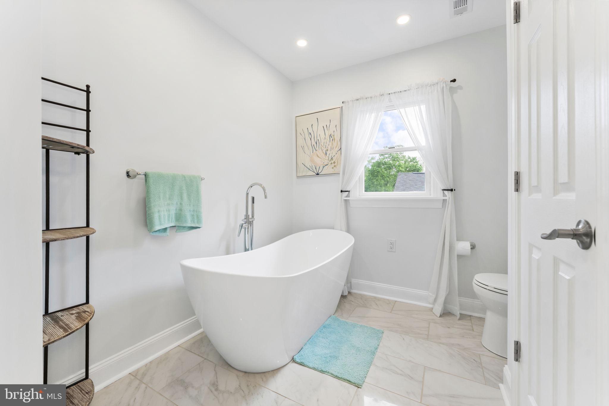 94 Crescent Lane Elkton, MD 21921 - Photo 36 of 59 a bathroom with a bathtub and toilet