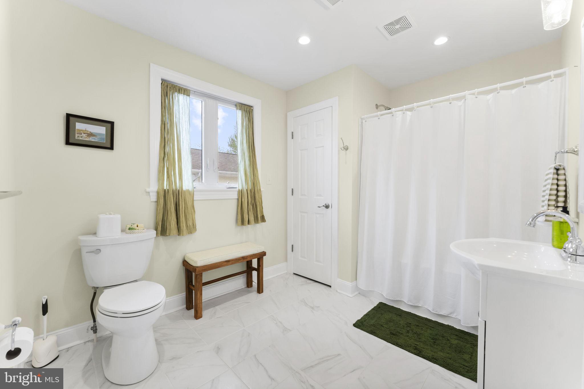 94 Crescent Lane Elkton, MD 21921 - Photo 40 of 59 a bathroom with a toilet a sink and a window