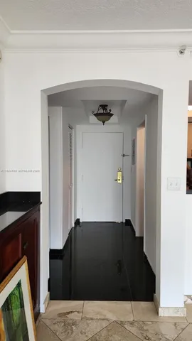 a black and white kitchen with a sink