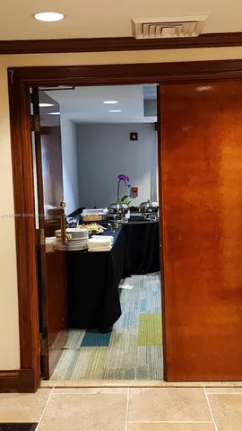 a kitchen with a sink and a refrigerator