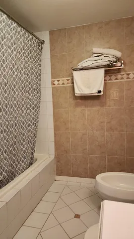 a bathroom with a bathtub and shower