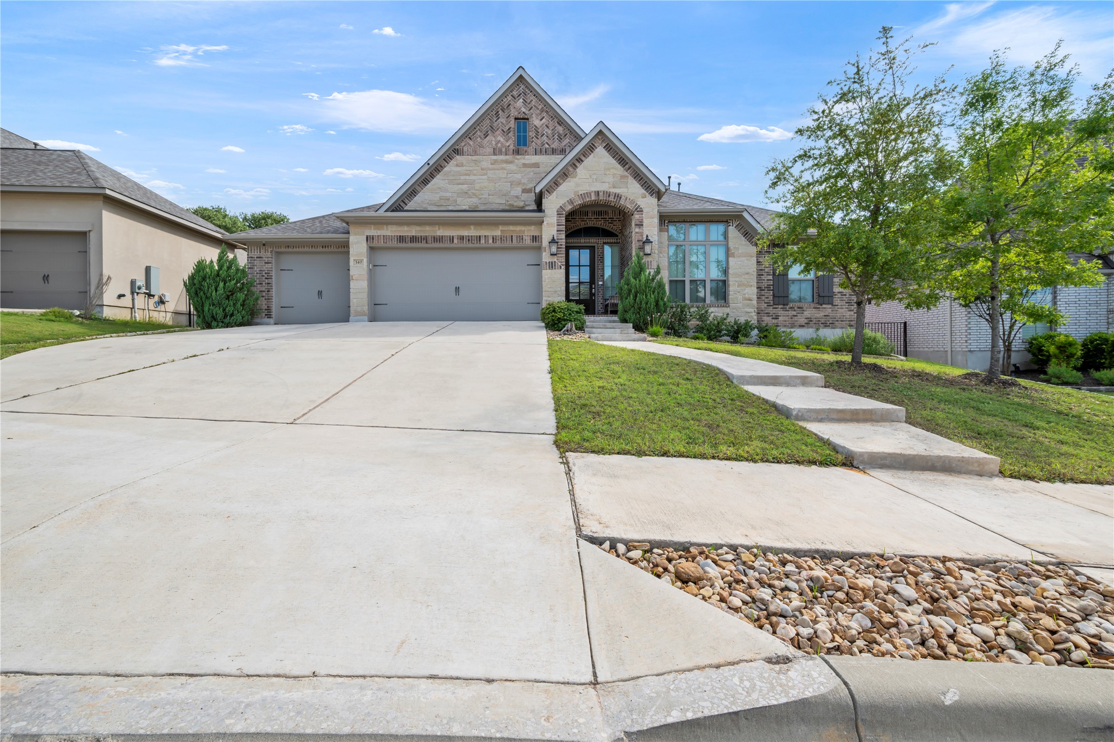 140 Catani Loop Georgetown, TX 78628 - Photo 1 of 36 A striking exterior combines brick and stone accents, creating impressive curb appeal.