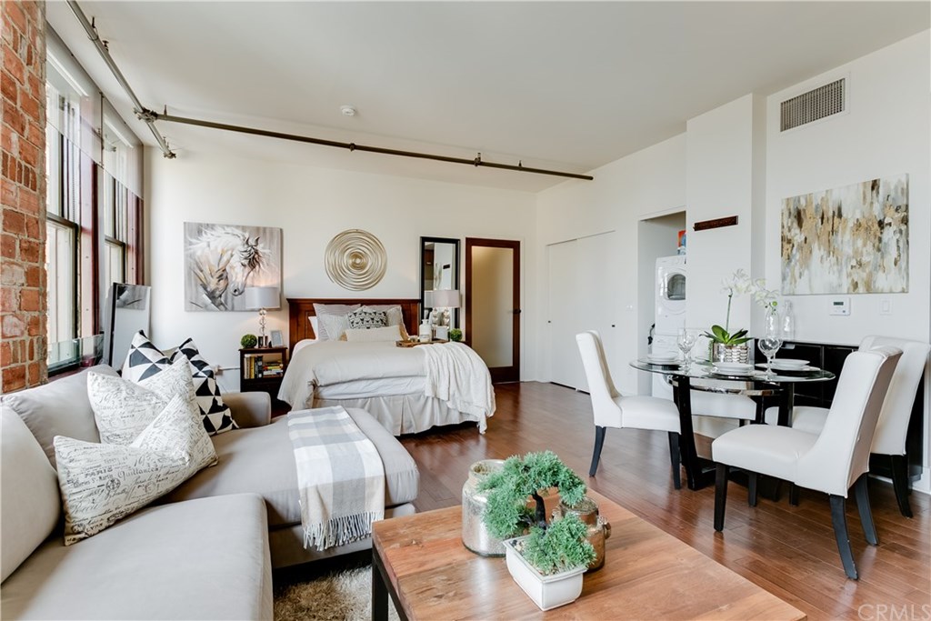 a bed room with a bed and a chair