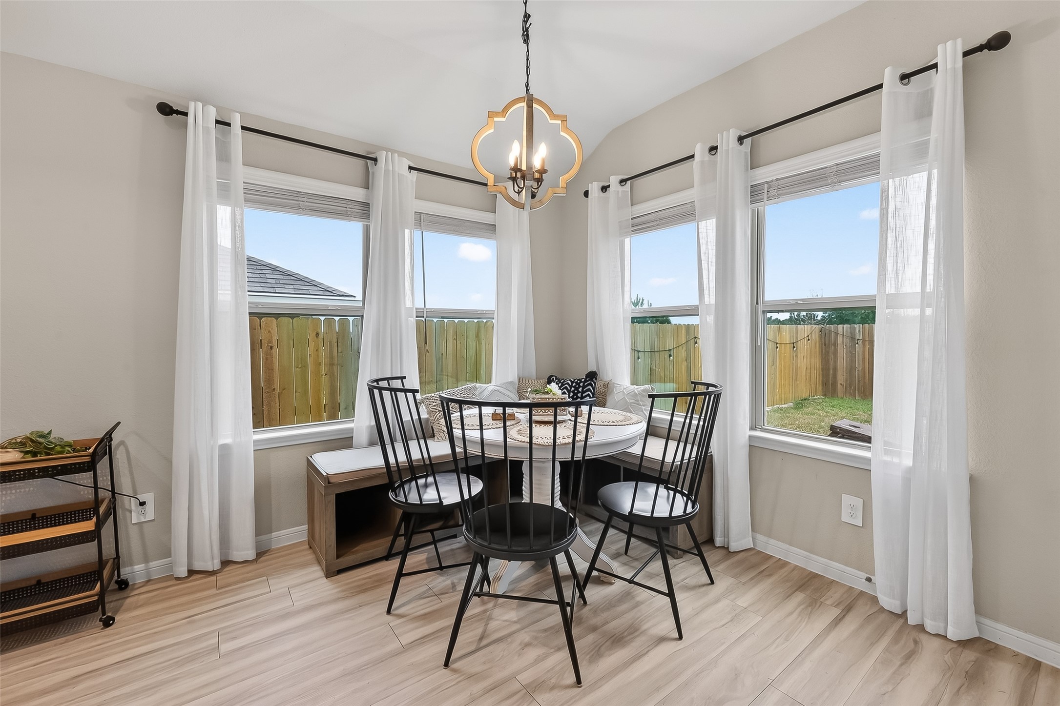 689 Red Elm Lane Conroe, TX 77304 - Photo 13 of 37 a dining room with furniture a chandelier and wooden floor
