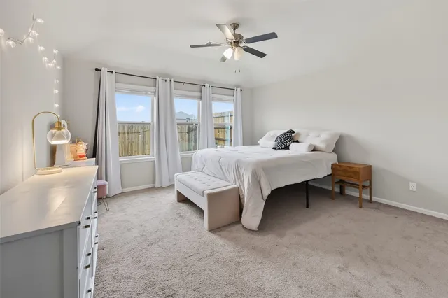 a bathroom with double vanity sinks a vanity a lamp and a mirror