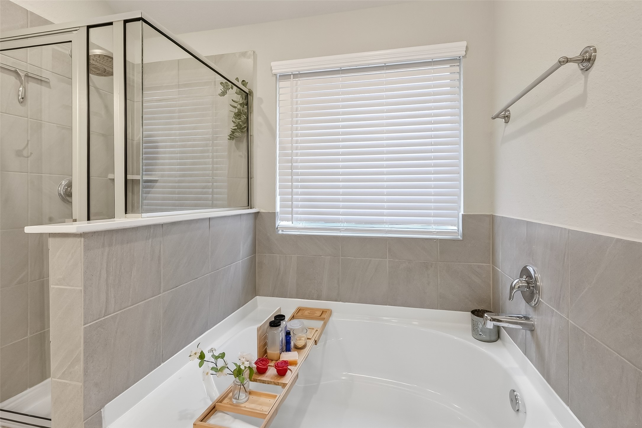 689 Red Elm Lane Conroe, TX 77304 - Photo 18 of 37 a bathroom with a tub and a window