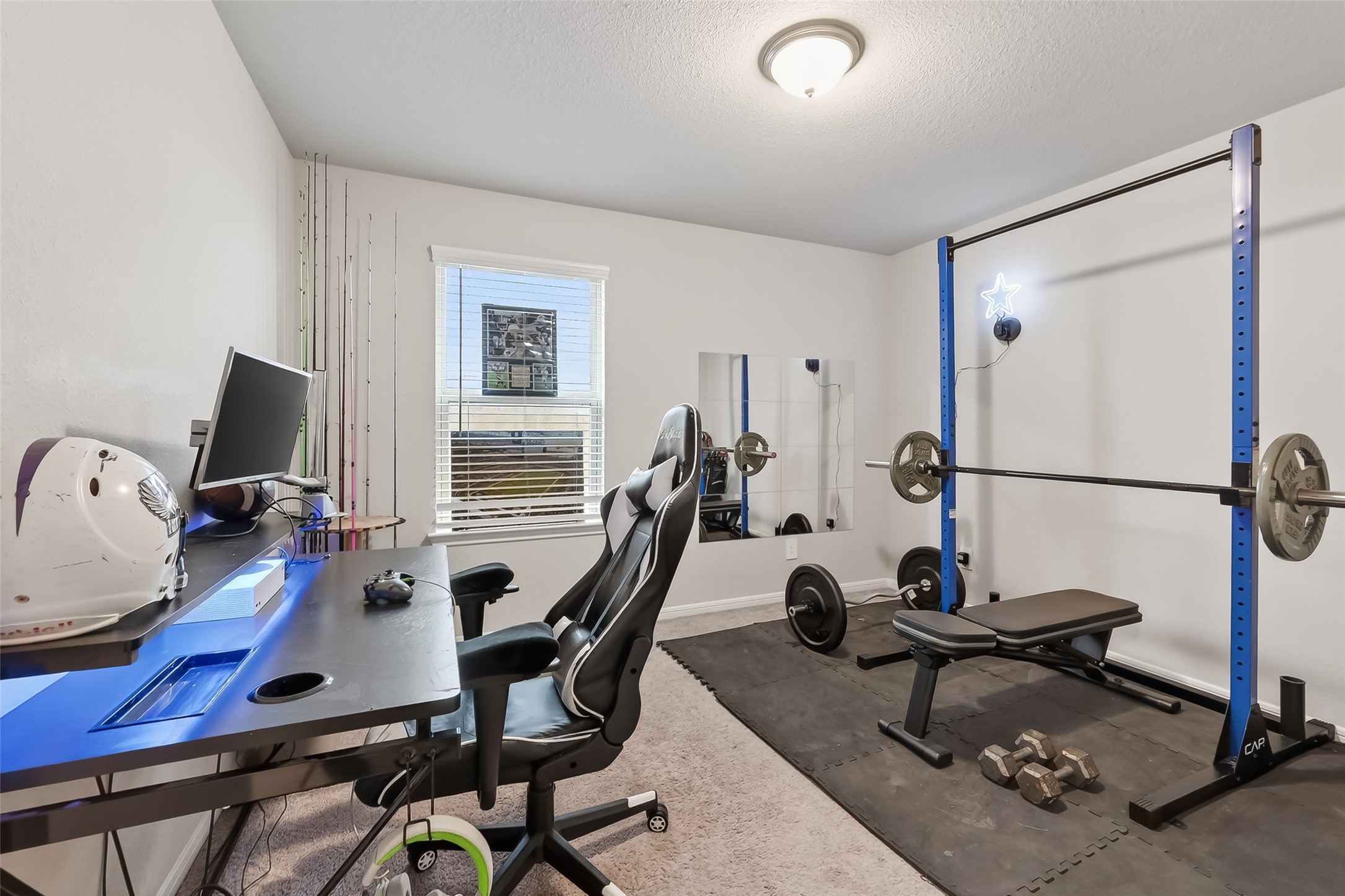 689 Red Elm Lane Conroe, TX 77304 - Photo 19 of 37 a view of a workspace with furniture and a window