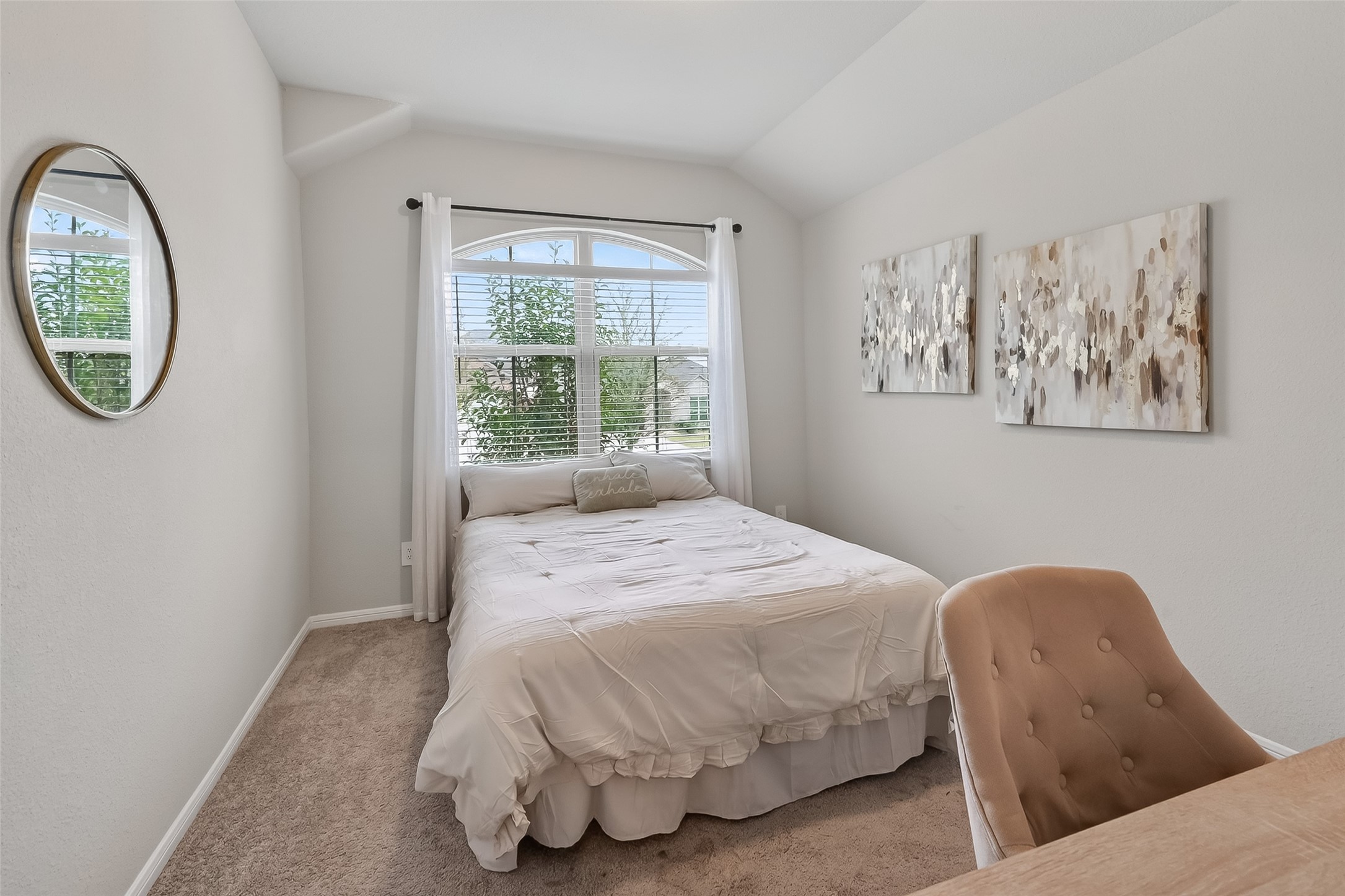 689 Red Elm Lane Conroe, TX 77304 - Photo 21 of 37 a bedroom with a bed and a painting on the wall