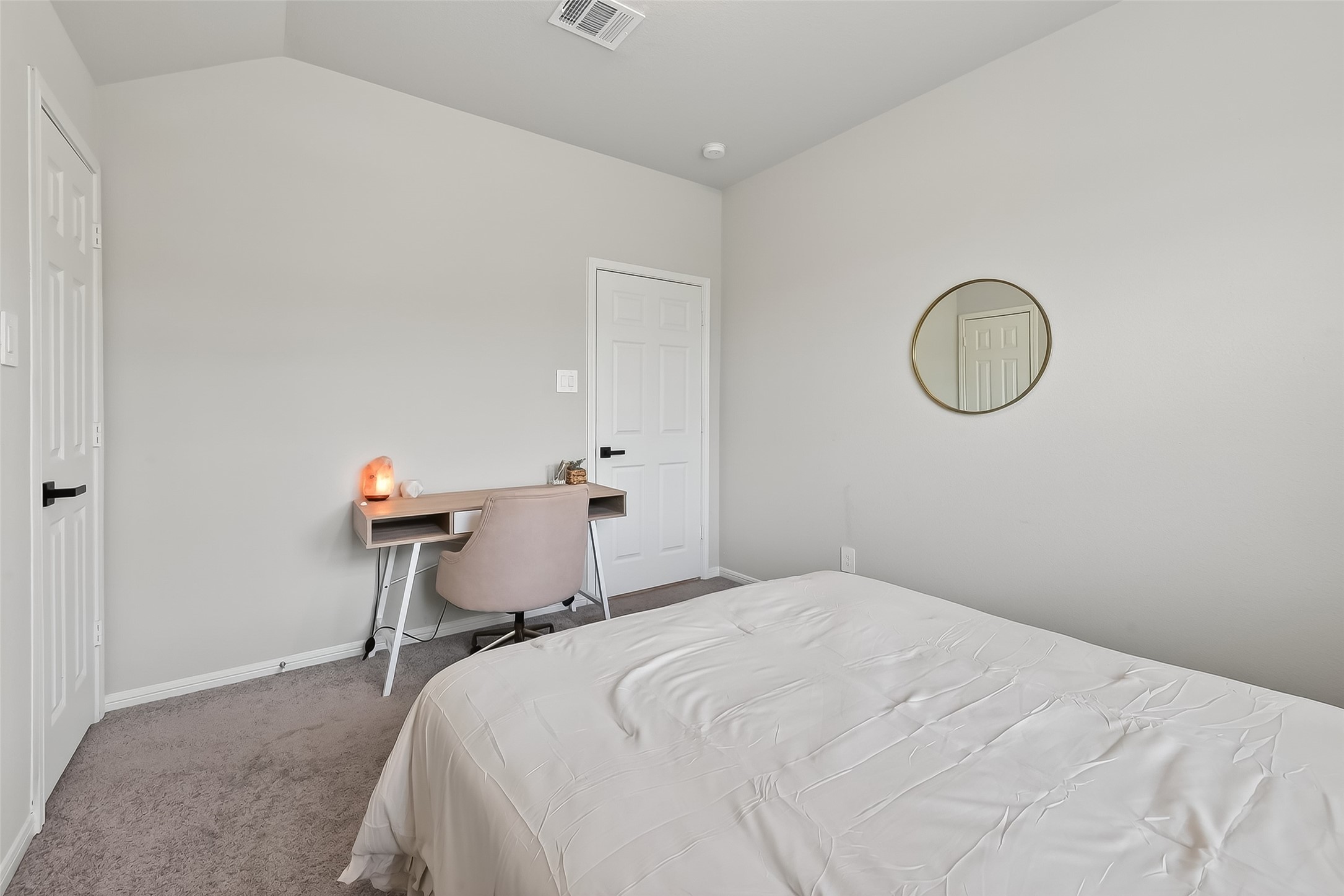 689 Red Elm Lane Conroe, TX 77304 - Photo 22 of 37 a bedroom with a bed a table and a chair