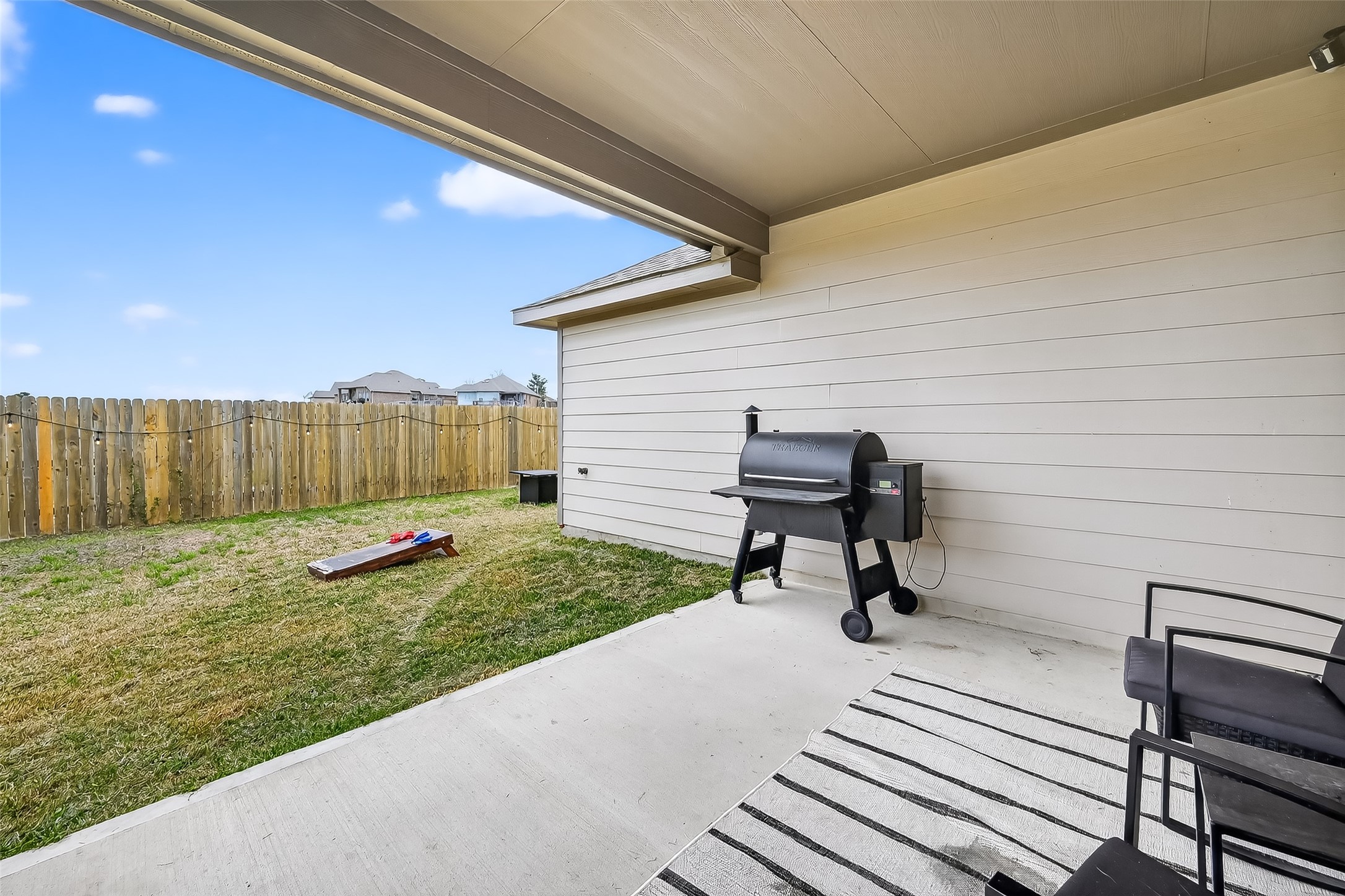 689 Red Elm Lane Conroe, TX 77304 - Photo 28 of 37 a view of a backyard with sitting area