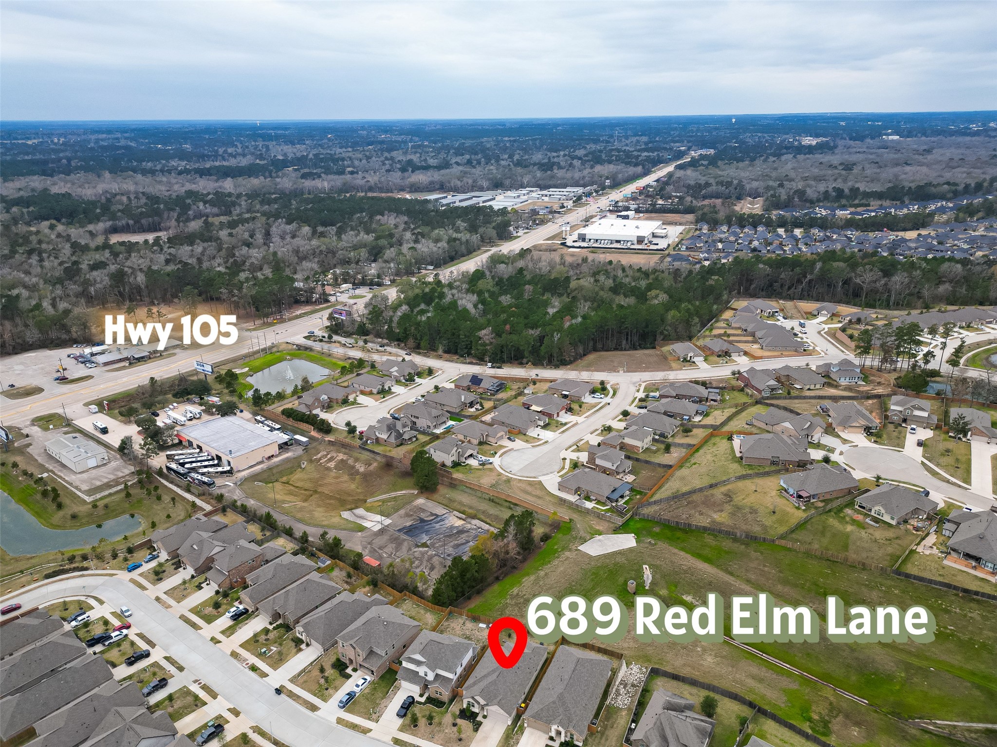 689 Red Elm Lane Conroe, TX 77304 - Photo 33 of 37 an aerial view of residential building and parking space