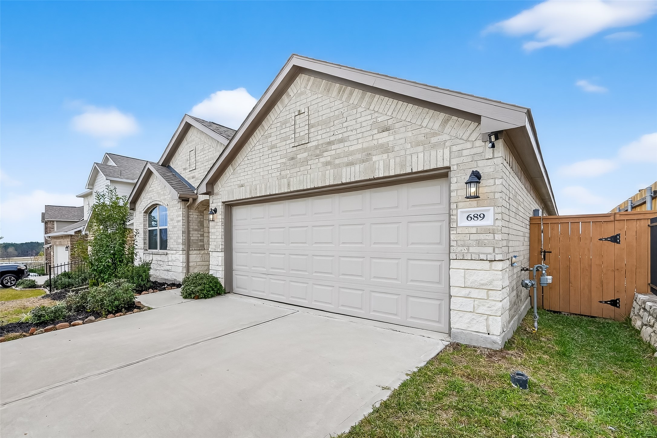 689 Red Elm Lane Conroe, TX 77304 - Photo 37 of 37 a view of a house with a garage