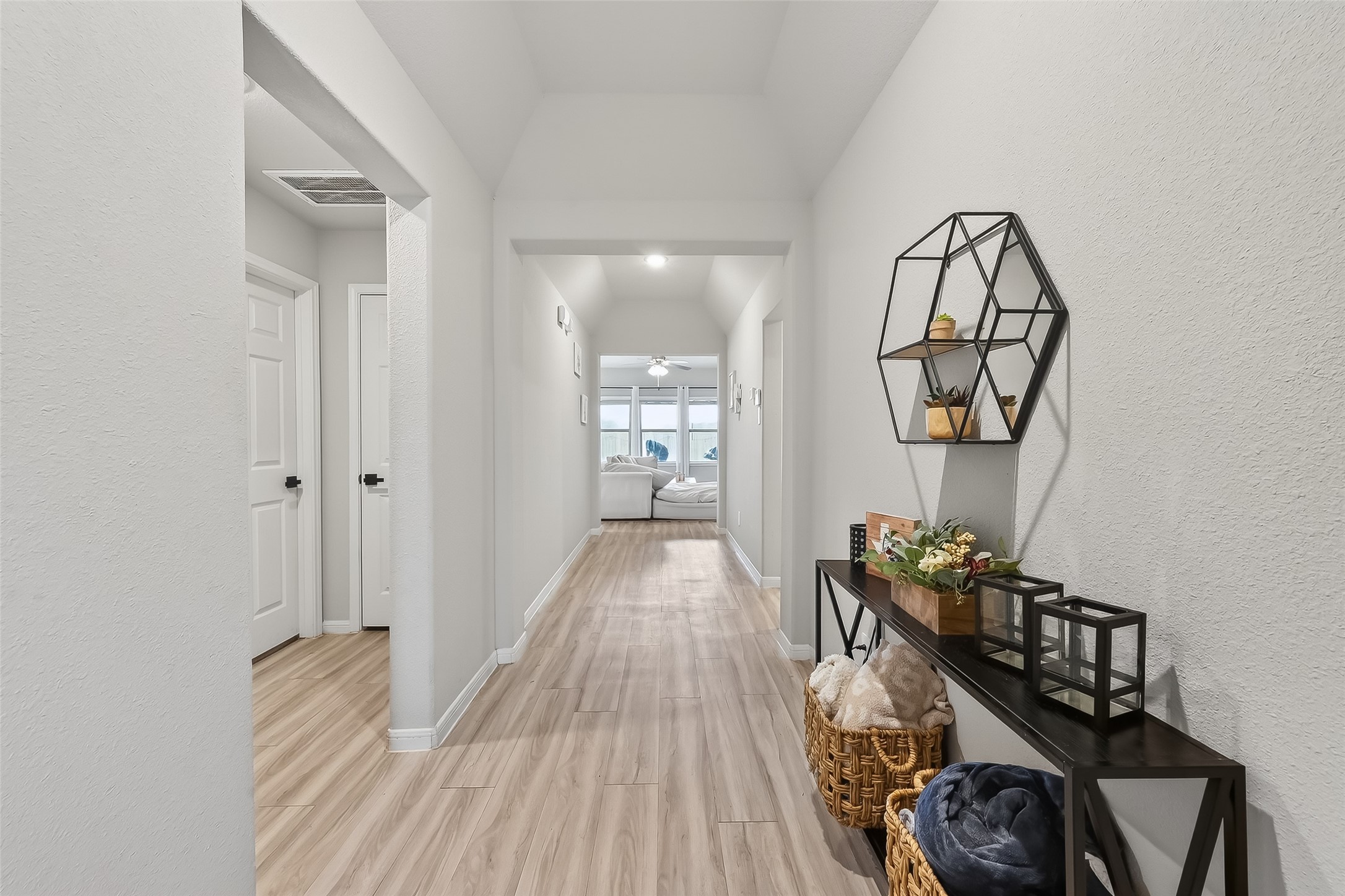 689 Red Elm Lane Conroe, TX 77304 - Photo 5 of 37 a view of a hallway to a livingroom and a wooden floor