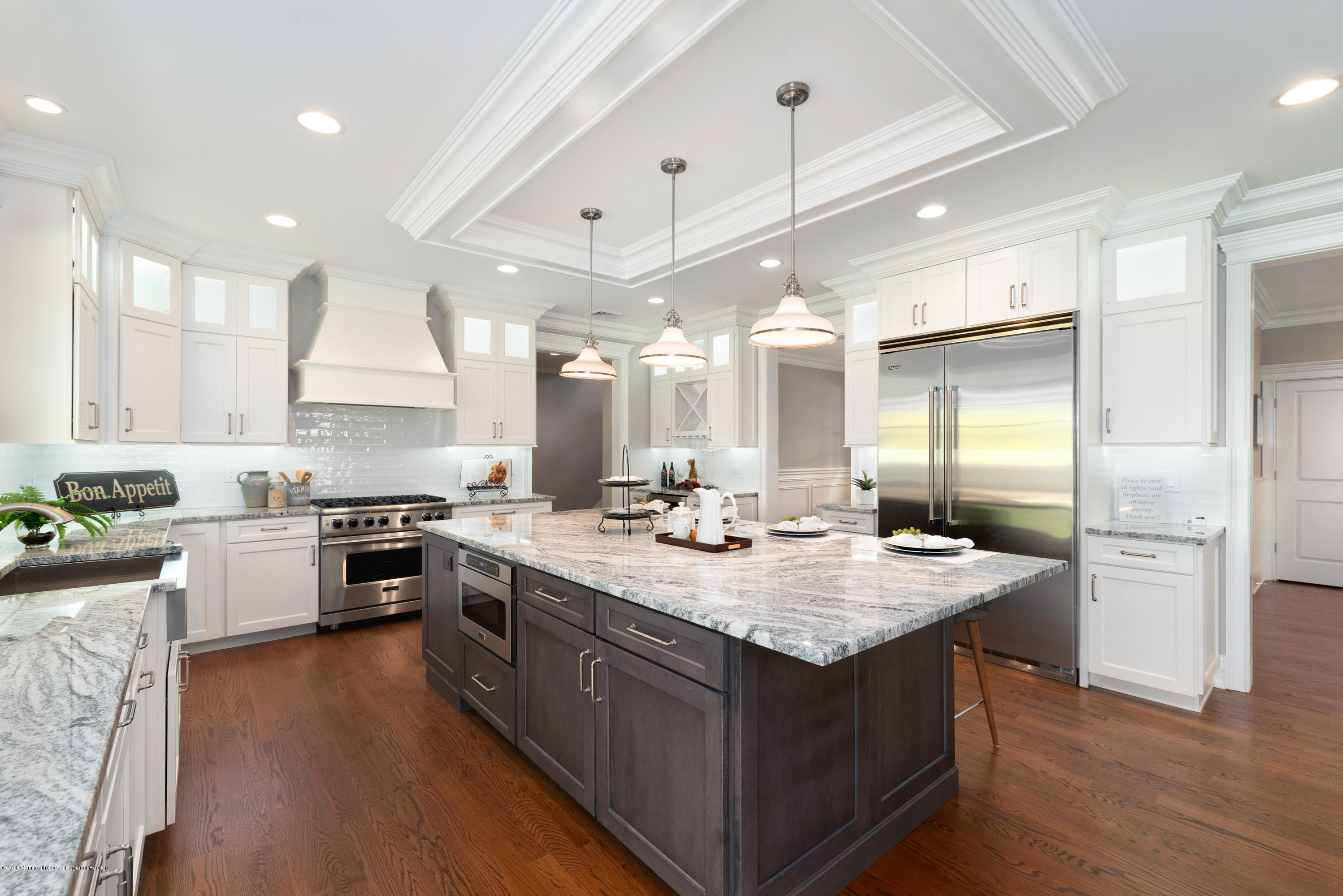 99 Rivers Edge Drive Little Silver, NJ 07739 - Photo 11 of 50 a large kitchen with stainless steel appliances lots of counter space and wooden floor