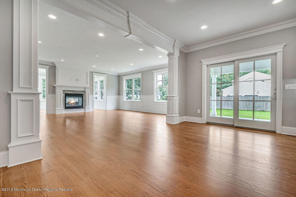 99 Rivers Edge Drive Little Silver, NJ 07739 - Photo 18 of 50 a view of an empty room with wooden floor and a window