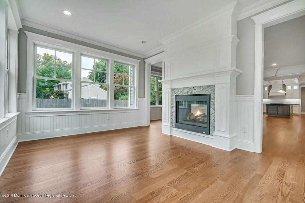 99 Rivers Edge Drive Little Silver, NJ 07739 - Photo 23 of 50 a view of an empty room with window and fire place