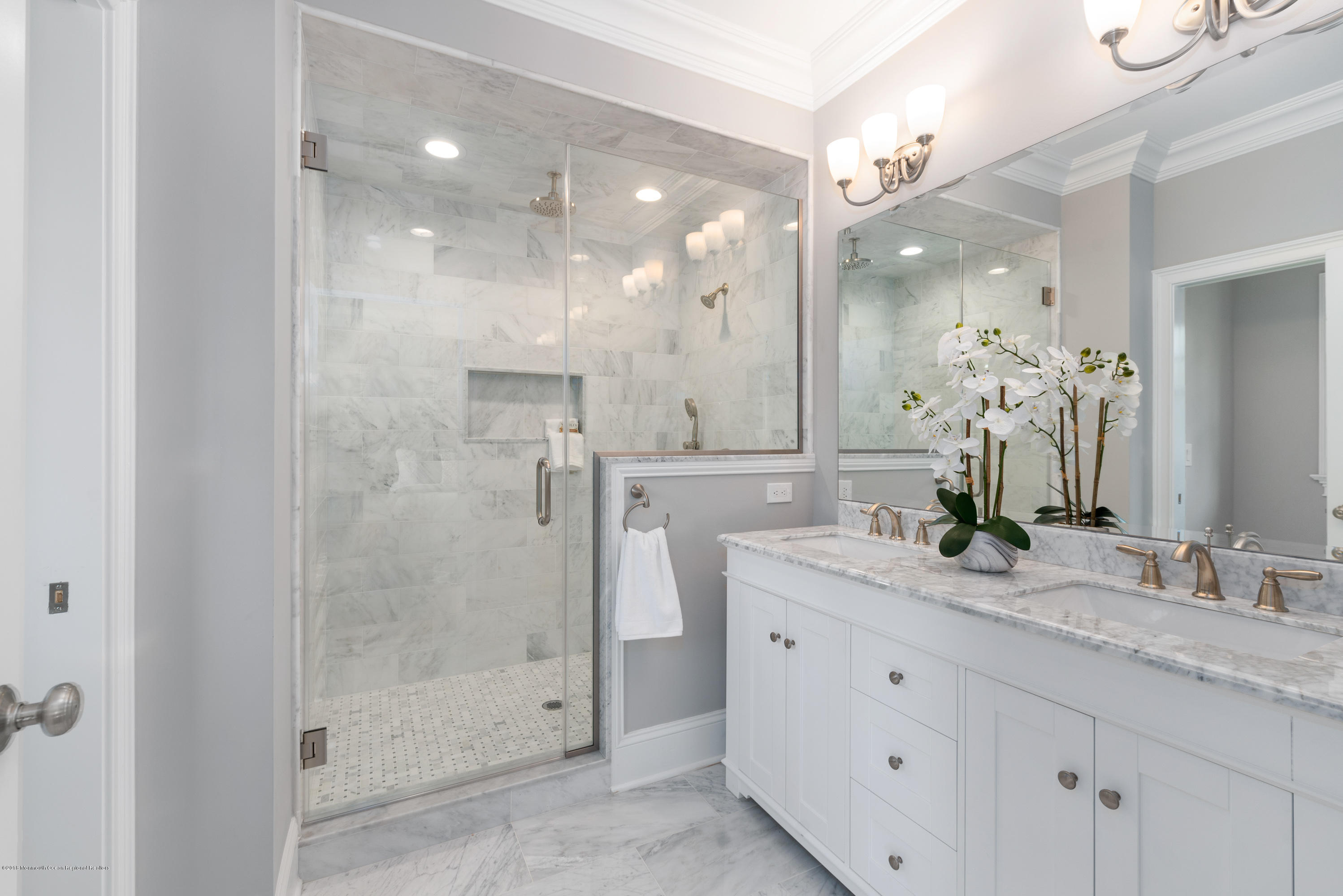 99 Rivers Edge Drive Little Silver, NJ 07739 - Photo 37 of 50 a bathroom with a granite countertop sink mirror and shower
