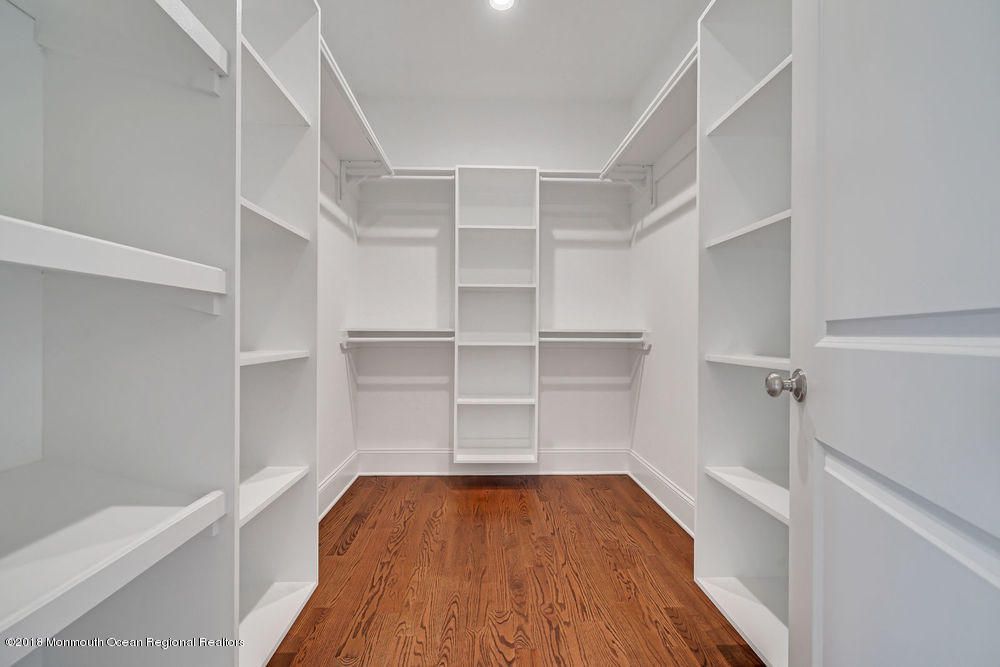 99 Rivers Edge Drive Little Silver, NJ 07739 - Photo 38 of 50 a view of walk in closet with empty racks