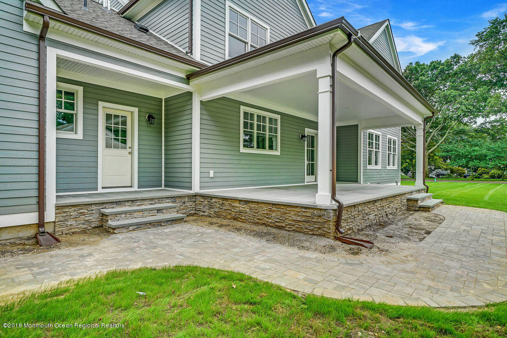 99 Rivers Edge Drive Little Silver, NJ 07739 - Photo 42 of 50 a view of a house with backyard and garden